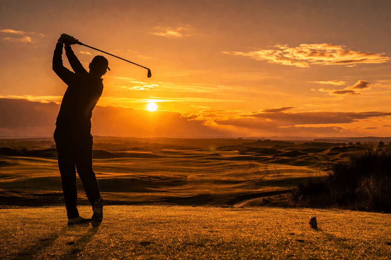 Golfer at sunset